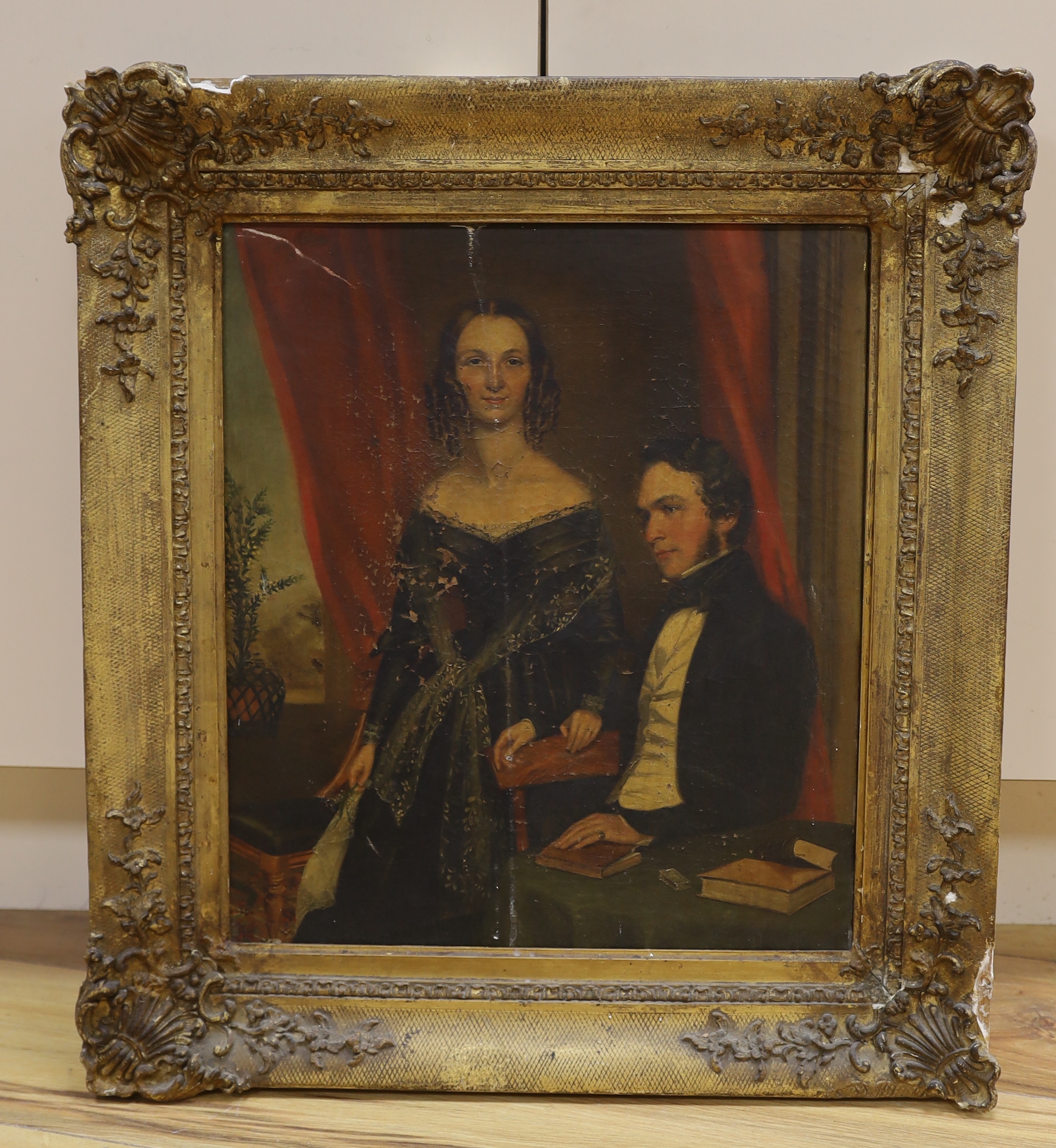 Mid 19th century English School, oil on canvas, Portrait of a lady and gentleman in an interior, 41 x 35cm, gilt framed